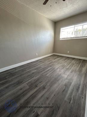 Long Beach apartment for rent - the living room of an empty house with wood floors