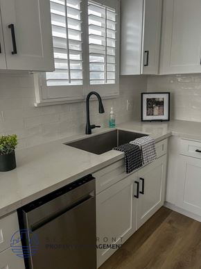 Hermosa Beach apartment for rent - a white kitchen with a sink and white cabinets