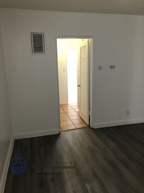 Whittier apartment for rent - a room with white walls and a door to a hallway