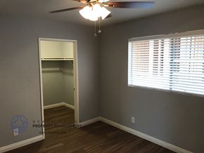 Los Angeles apartment for rent - the bedroom of a house with a closet and a ceiling fan