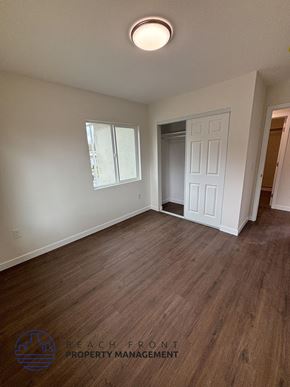 Whittier apartment for rent - A room with wooden flooring and a white door.