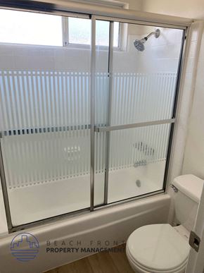 Torrance apartment for rent - a white bathroom with a shower and a toilet