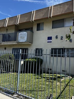 Los Angeles apartment for rent - A white building with a sign that says "Apartments" on it.