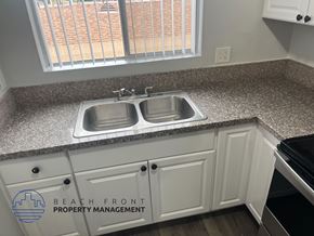 Long Beach apartment for rent - A kitchen with a sink and cabinets.