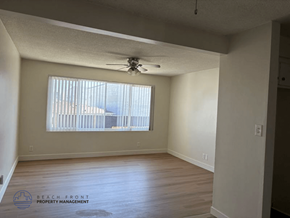 Torrance apartment for rent - A room with a ceiling fan and a window with blinds.
