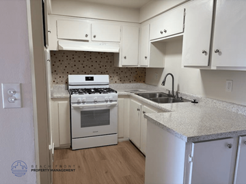 Torrance apartment for rent - A kitchen with a stove, sink and cabinets.