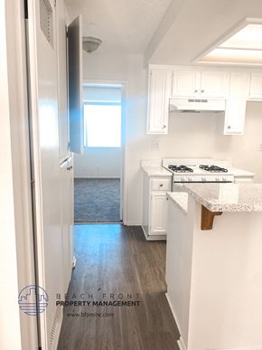 Torrance apartment for rent - A kitchen with white cabinets and a stove top oven.
