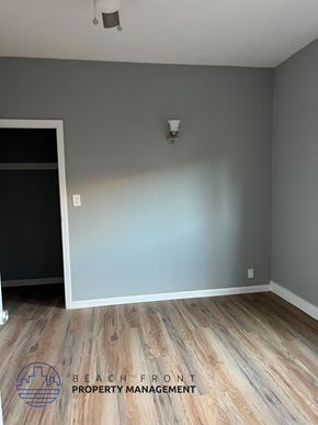 Los Angeles apartment for rent - A room with wooden flooring and a grey wall.