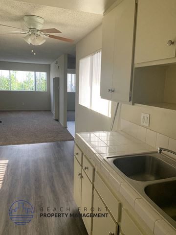 Wilmington apartment for rent - A kitchen with a sink and a fan.