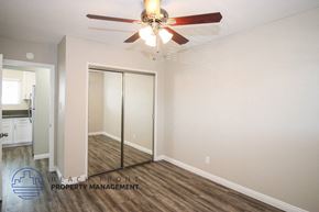 Torrance apartment for rent - a bedroom with a ceiling fan and a closet