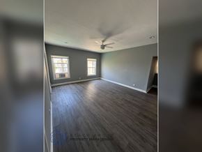 Los Angeles apartment for rent - A room with wooden flooring and a ceiling fan.