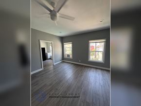 Los Angeles apartment for rent - A room with a ceiling fan and two windows.