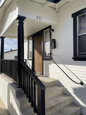 San Pedro apartment for rent - the front of a house with stairs and a door