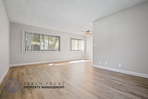 Playa Del Rey apartment for rent - A spacious room with wooden flooring and a ceiling fan.