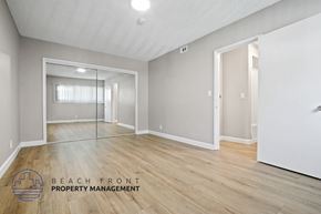 Playa Del Rey apartment for rent - A spacious room with a large mirror and wooden flooring.