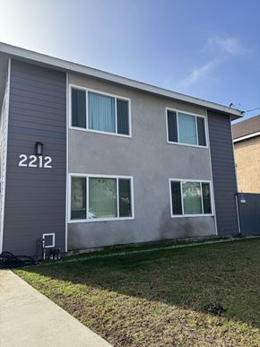 Redondo Beach apartment for rent - A grey house with the number 2212 on the front.