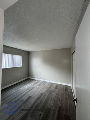 Long Beach apartment for rent - an empty room with wood floors and a window