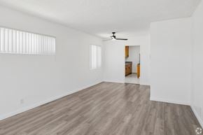 Gardena apartment for rent - A room with a ceiling fan and wooden flooring.
