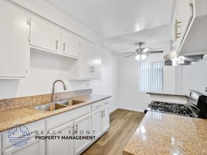 Long Beach apartment for rent - A kitchen with a countertop and a stove top oven.
