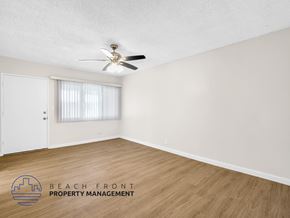 Downey apartment for rent - A room with a ceiling fan and wooden flooring.