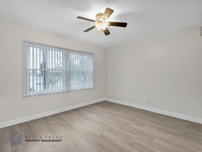 Los Angeles apartment for rent - A room with a ceiling fan and a window with blinds.