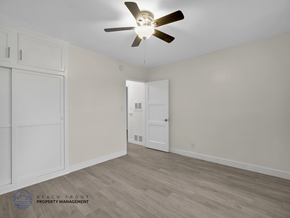 Los Angeles apartment for rent - A room with a ceiling fan and wooden flooring.