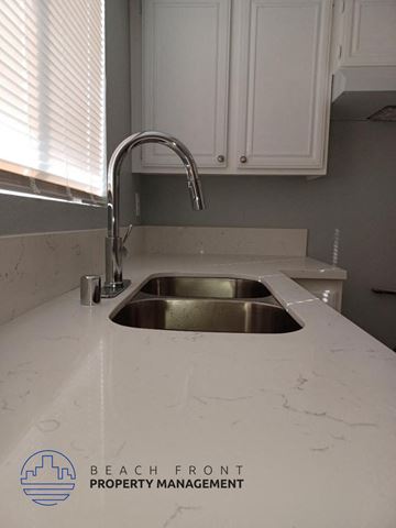 Hawthorne apartment for rent - a white counter top with a sink in a kitchen
