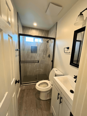 San Pedro apartment for rent - a small bathroom with a shower toilet and sink