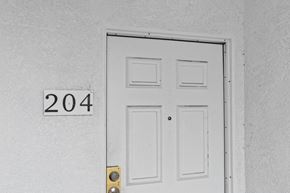 San Pedro apartment for rent - A white door with a number 204 on the wall above it.