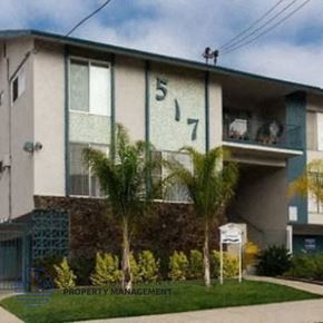 Inglewood apartment for rent - a building with palm trees in front of it