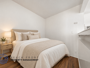 Los Angeles apartment for rent - A bedroom with a bed, nightstand, and lamp.