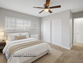 Long Beach apartment for rent - A bedroom with a bed, a ceiling fan, and a window with blinds.