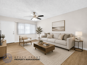 Downey apartment for rent - A living room with a couch, chair, and coffee table.