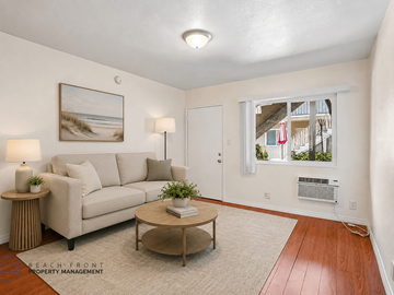 Los Angeles apartment for rent - A living room with a couch, a table, and a painting on the wall.