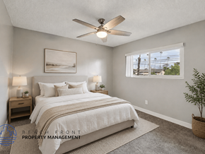 Alhambra apartment for rent - A bedroom with a large bed and a ceiling fan.