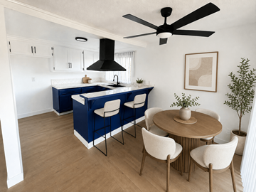 Westminster apartment for rent - A kitchen with a blue island and white chairs.