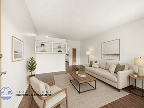 Hawthorne apartment for rent - A living room with a white couch, a chair, a coffee table, and a plant.