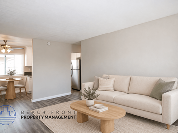 Torrance apartment for rent - A living room with a couch, a coffee table, and a dining table with chairs.