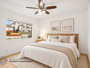 San Pedro apartment for rent - A bedroom with a large bed and a ceiling fan.