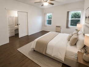 Wilmington apartment for rent - A bedroom with a bed, dresser, and window.