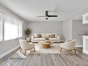 Redondo Beach apartment for rent - A living room with a white couch, two chairs, and a coffee table.