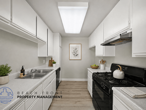 Los Angeles apartment for rent - A kitchen with a stove top oven and a sink.