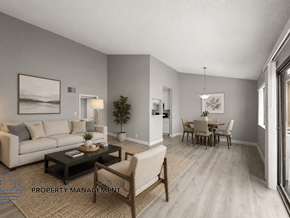 Los Angeles apartment for rent - A living room with a couch, coffee table, and chairs.