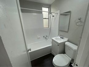 Wilmington apartment for rent - a bathroom with a toilet and a tub and a sink
