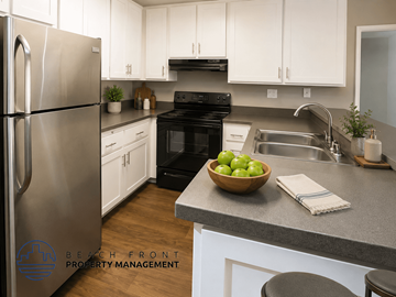 San Pedro apartment for rent - A kitchen with a refrigerator, oven, and sink.