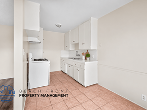 Gardena apartment for rent - A kitchen with white appliances and cabinets.