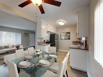 Anaheim apartment for rent - A modern dining room with a glass table set for four.