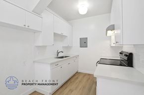 Long Beach apartment for rent - A kitchen with white cabinets and a sink.