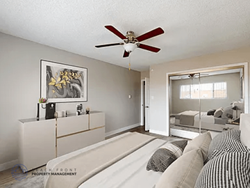 Inglewood apartment for rent - A living room with a ceiling fan and a painting on the wall.