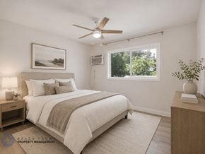 Long Beach apartment for rent - A bedroom with a bed, nightstand, and a painting on the wall.
